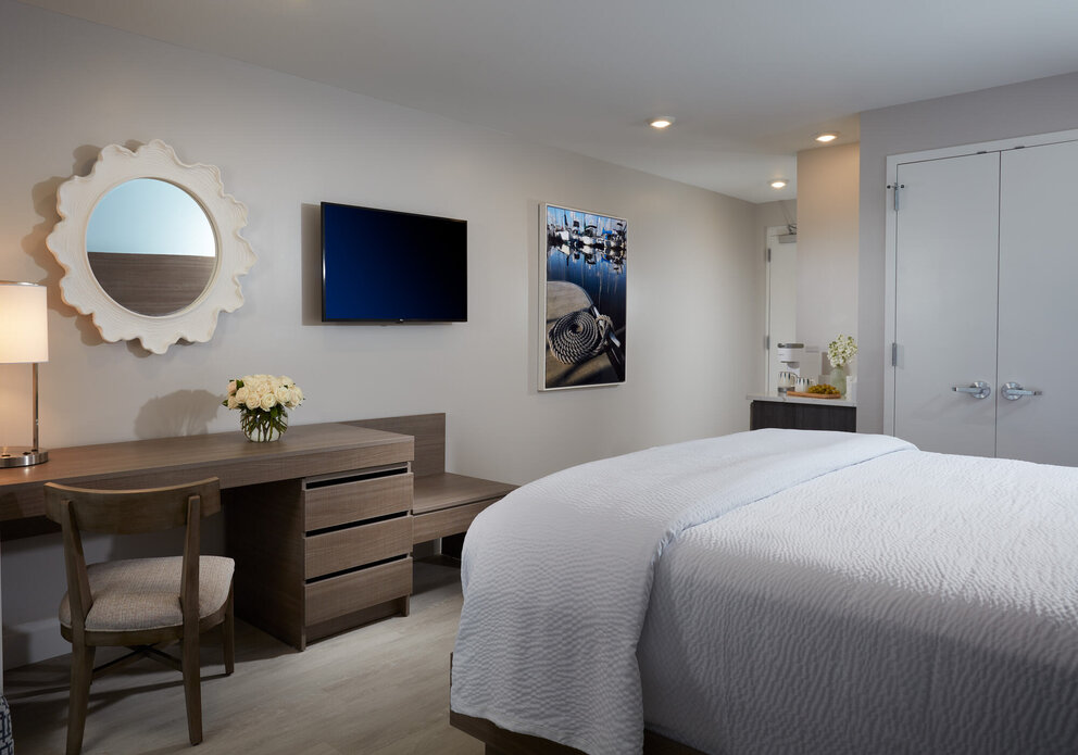 bed and desk at our jupiter beach hotel