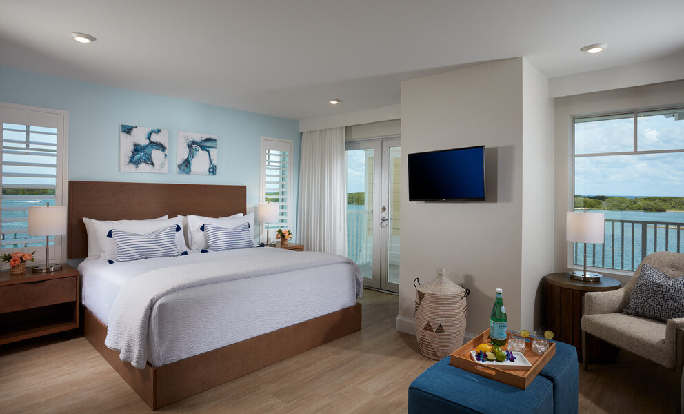 bedroom with water views at our jupiter beach hotel